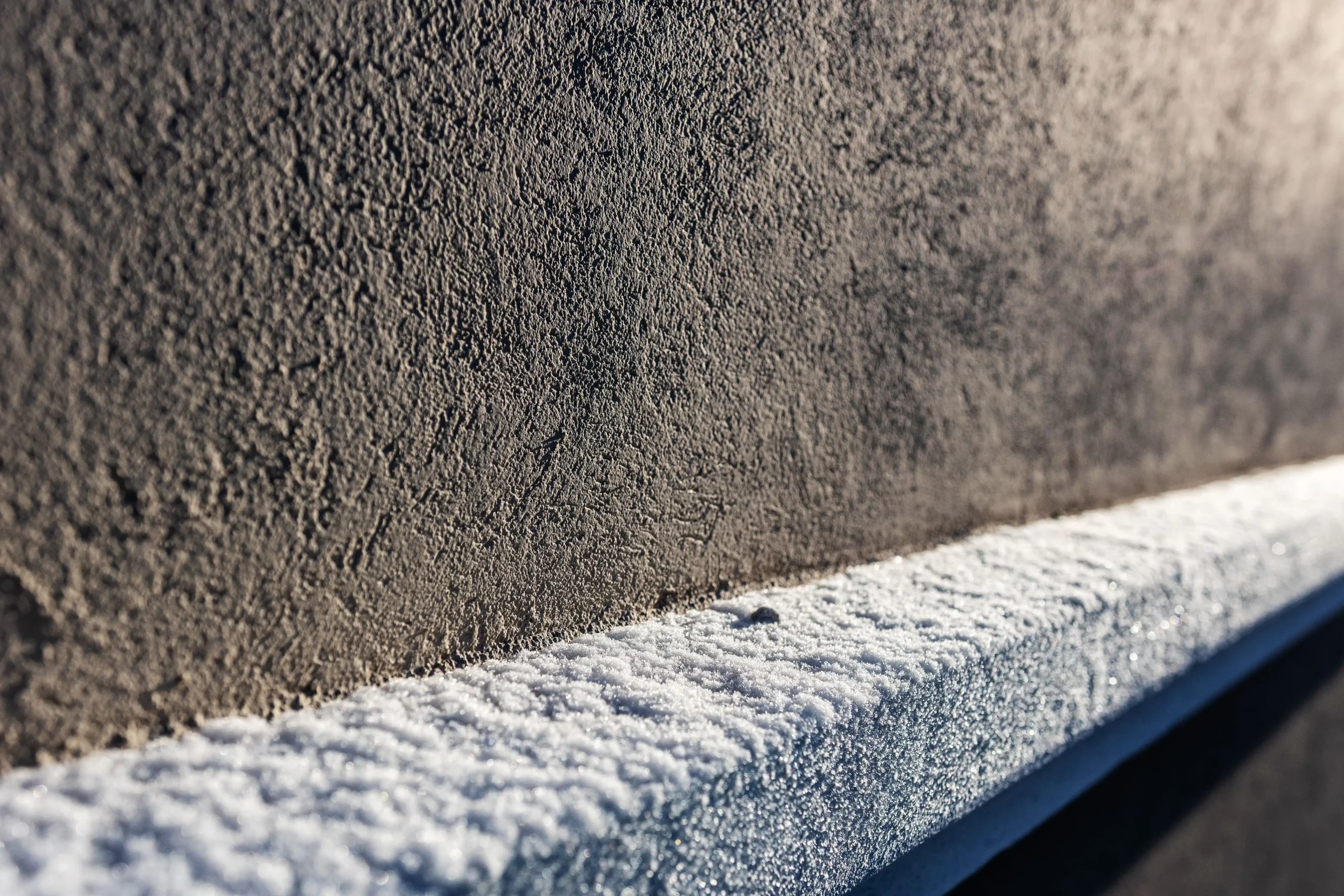 closeup-of-snow-on-the-side-of-building-2026-03-24-10-13-29-utc