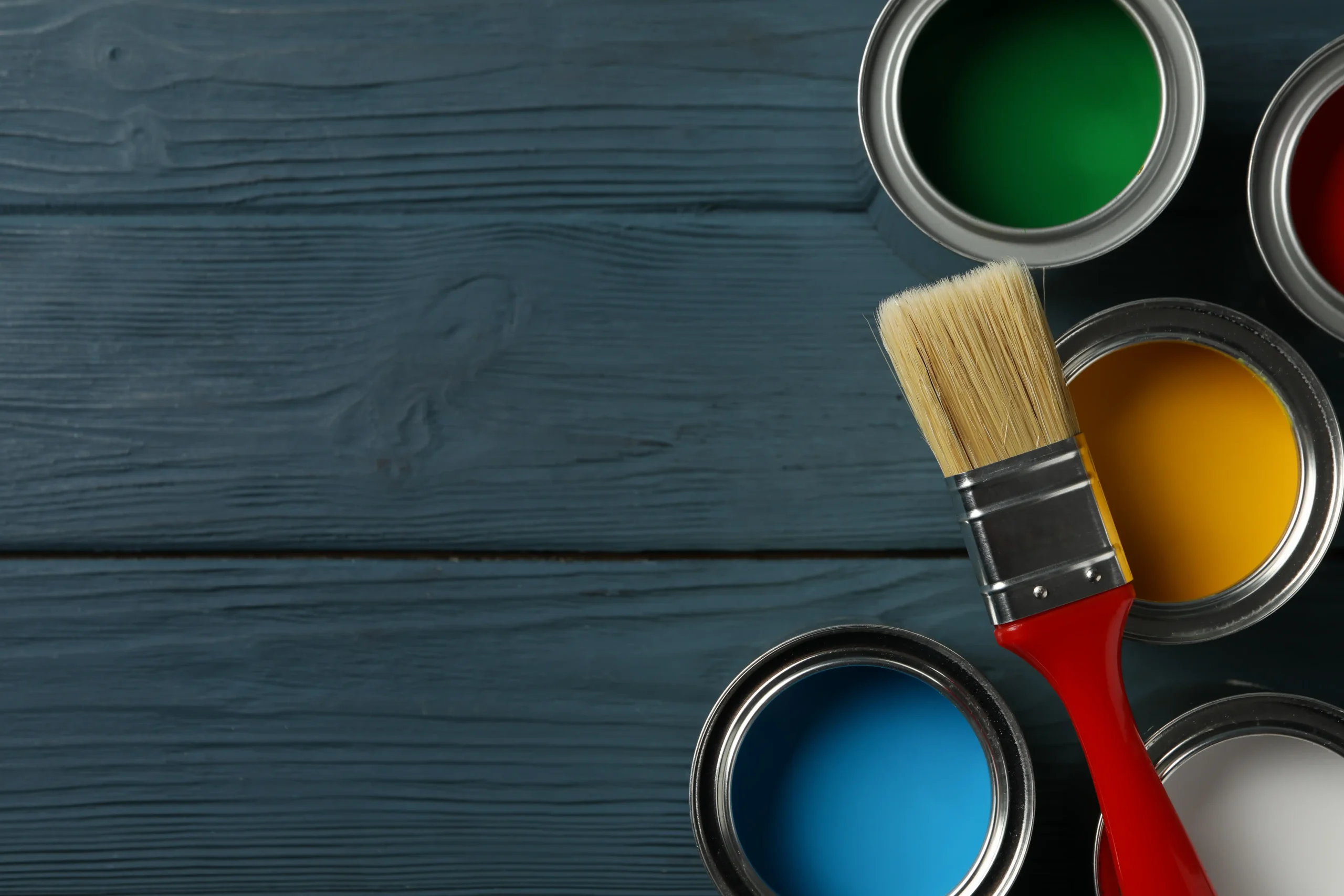 paint-cans-and-brush-on-wooden-background-top-vie-2026-03-25-02-46-06-utc